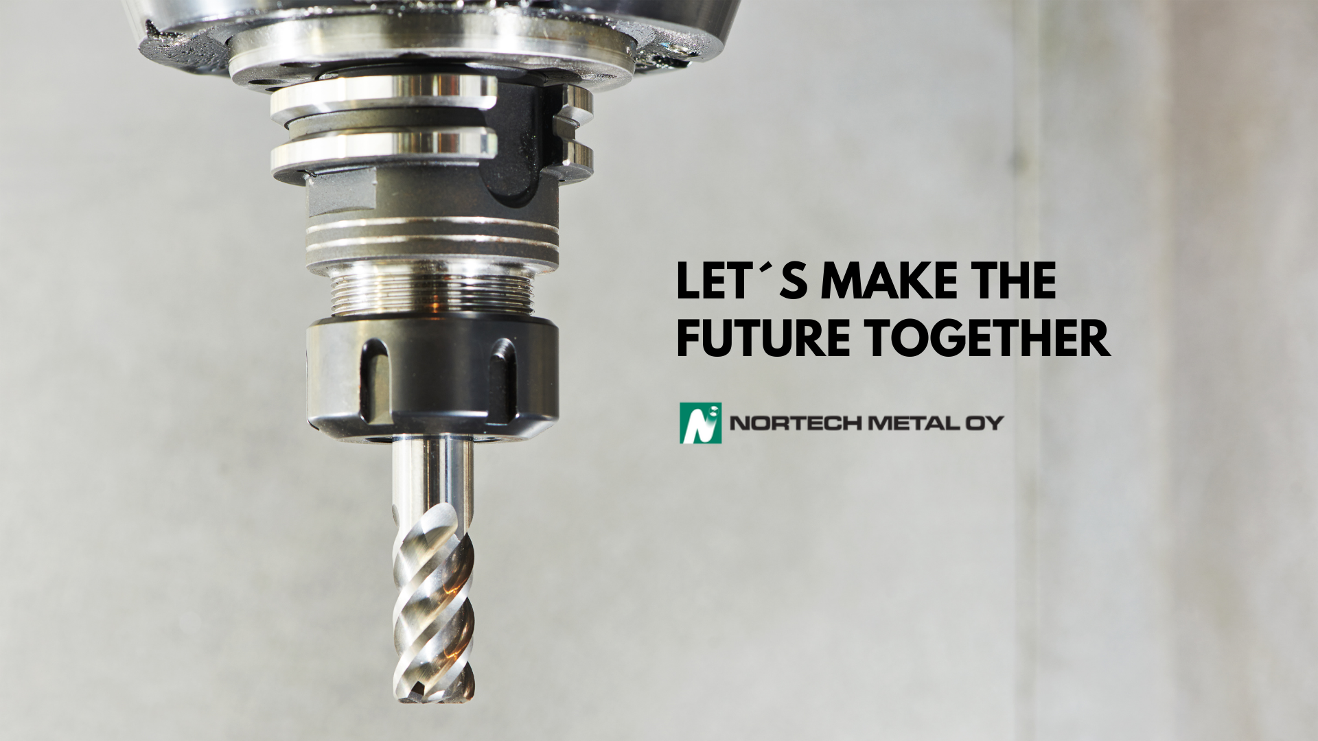 Jyrsinkone. Kuvassa teksti englanniksi: Let's make the future together. Nortech Metal Oy.